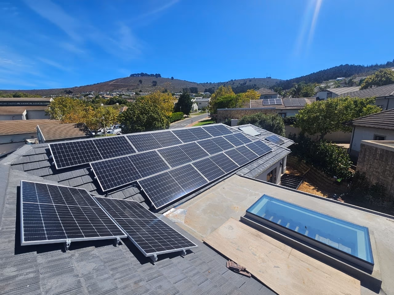A rooftop solar installation on a Container Home SA build, panels catching full sun