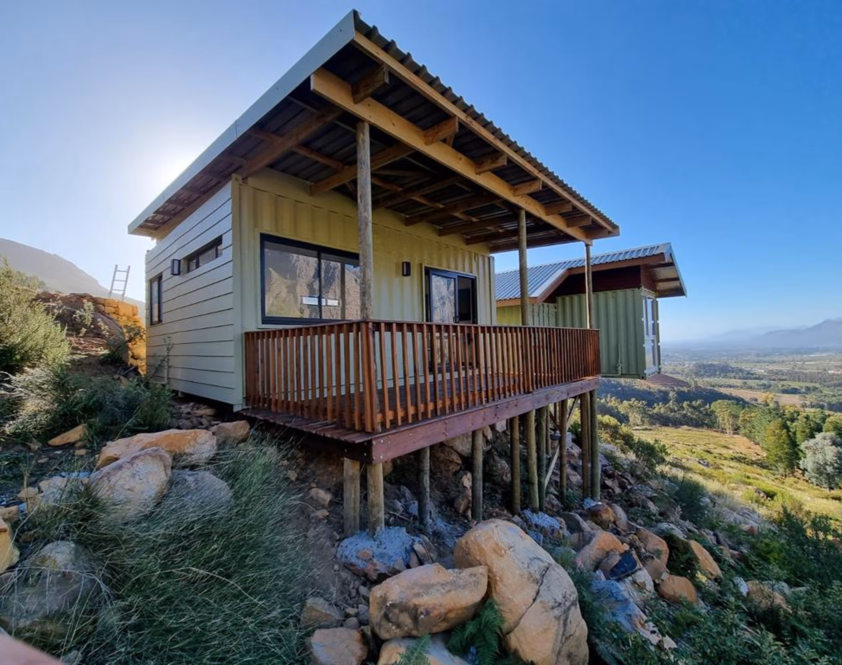 The Studio delivered on a hillside with a covered deck